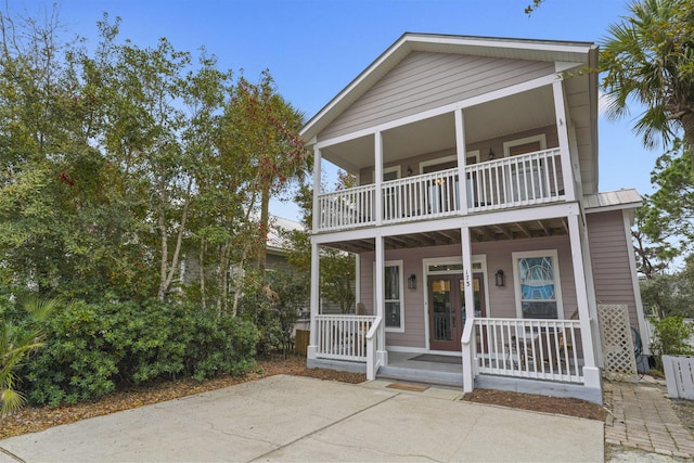 view of front of house featuring a balcony and covered porch