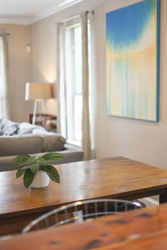 dining area featuring crown molding