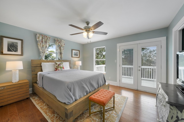 bedroom with access to exterior, dark wood-type flooring, french doors, and ceiling fan