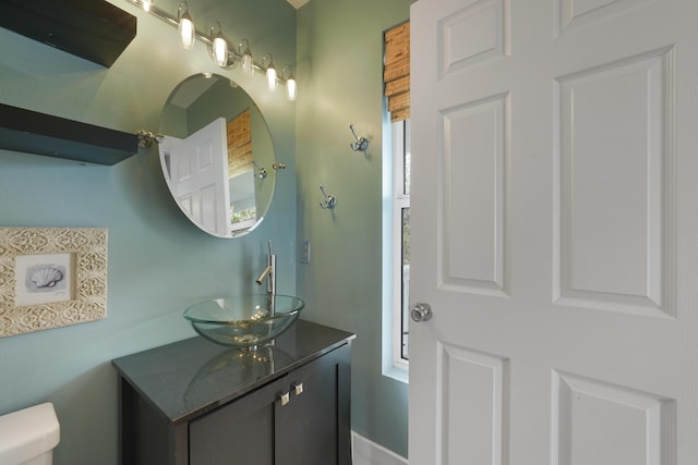 bathroom with vanity and toilet