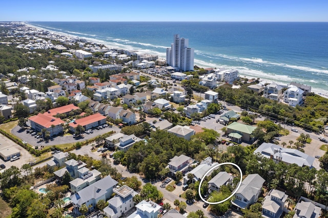 aerial view featuring a water view and a beach view