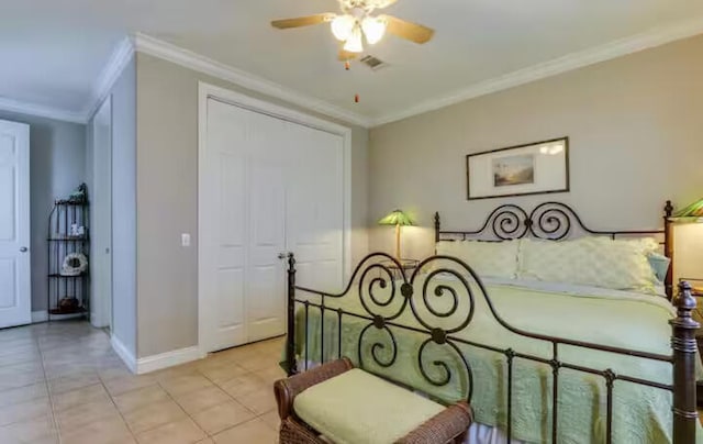 bedroom featuring crown molding, light tile patterned floors, and ceiling fan