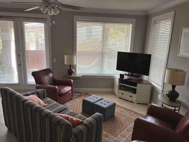 living room featuring ornamental molding, light tile patterned floors, and ceiling fan