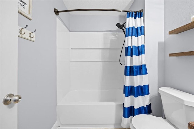 full bath with a textured ceiling, shower / bath combo with shower curtain, and toilet