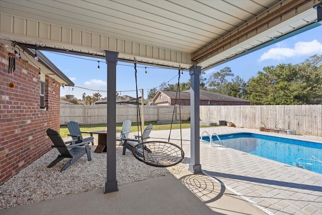 view of pool featuring a fenced in pool, a fenced backyard, and a patio