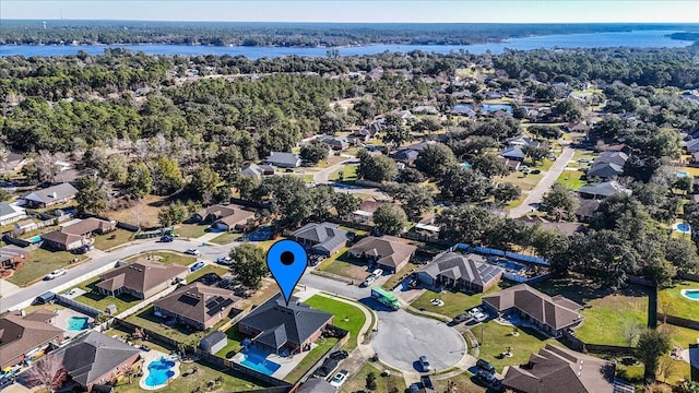 birds eye view of property featuring a water view and a residential view