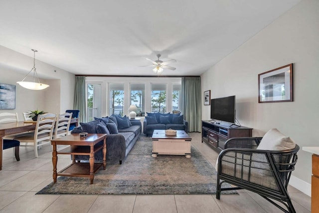 living room featuring ceiling fan and light tile patterned floors