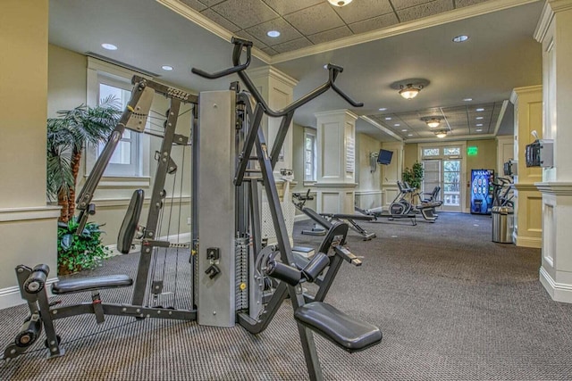 workout area with ornamental molding, carpet, and ornate columns