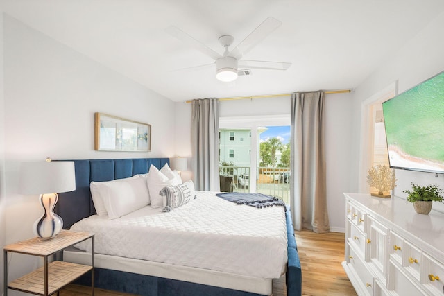 bedroom featuring ceiling fan, light hardwood / wood-style flooring, and access to outside