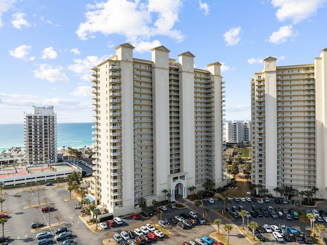 view of property featuring a water view and a city view