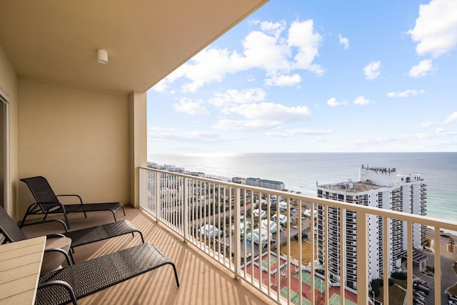 balcony featuring a water view