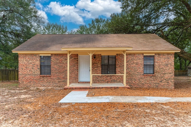 single story home with a porch