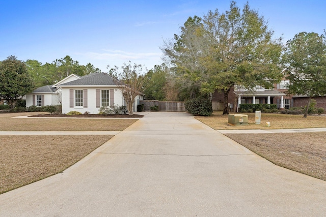 ranch-style home with a front lawn