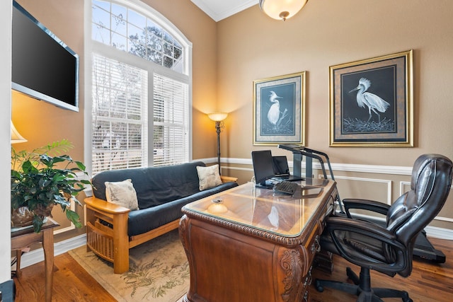 home office featuring hardwood / wood-style flooring and ornamental molding