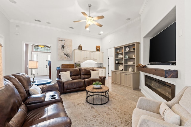 living room featuring crown molding and ceiling fan