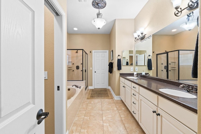 bathroom featuring vanity, separate shower and tub, and tile patterned floors