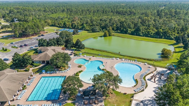 birds eye view of property with a water view