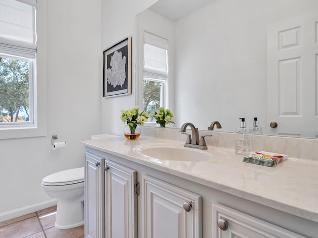 bathroom with vanity, tile patterned floors, and toilet