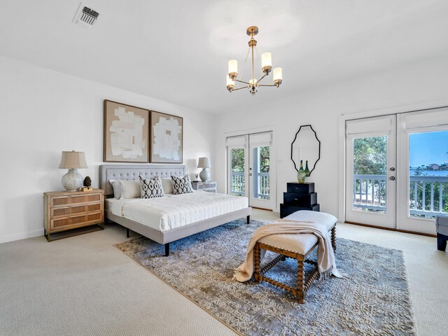 bedroom featuring access to outside, light colored carpet, and french doors