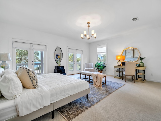 bedroom featuring carpet floors, a notable chandelier, access to outside, and french doors