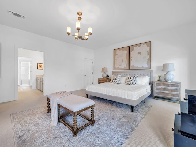 bedroom featuring connected bathroom, light colored carpet, and a chandelier