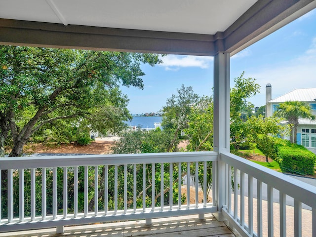 balcony featuring a water view