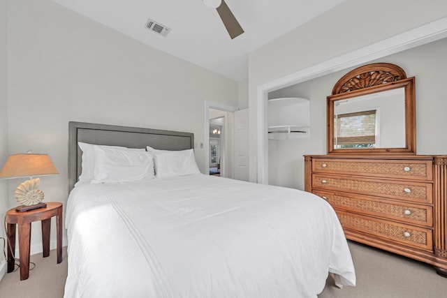 bedroom with carpet floors, ceiling fan, and a closet