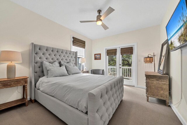 bedroom featuring light carpet, access to outside, french doors, and ceiling fan