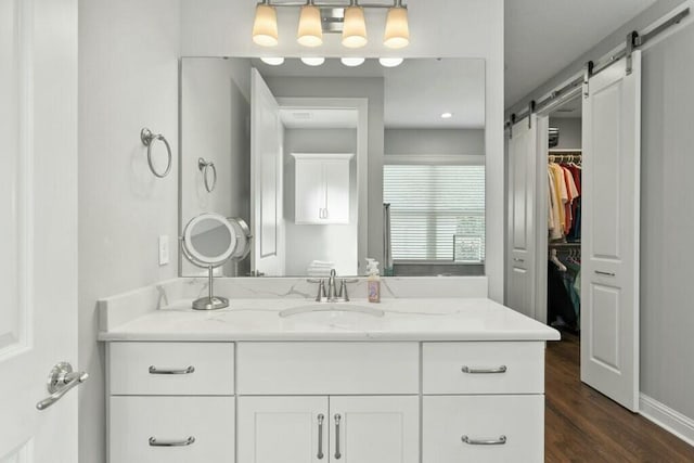 bathroom with vanity and hardwood / wood-style floors