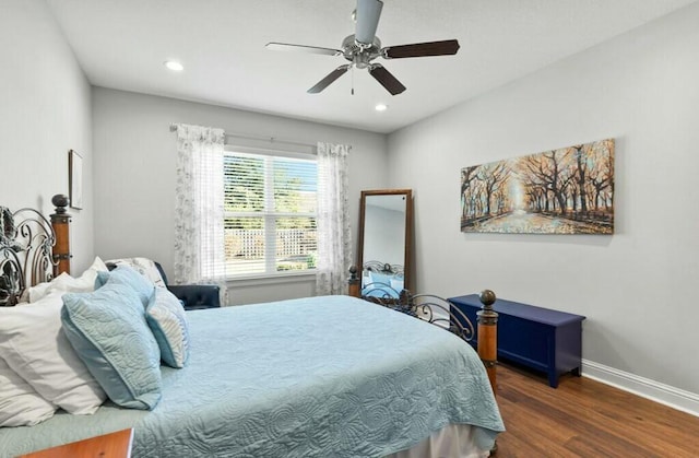 bedroom featuring ceiling fan and dark hardwood / wood-style flooring