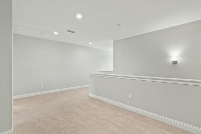 spare room with light colored carpet