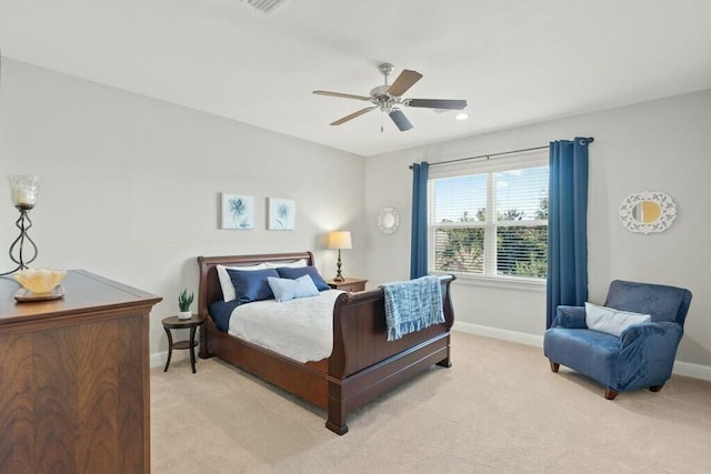 bedroom featuring ceiling fan and light carpet