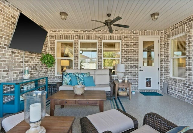 view of patio / terrace with an outdoor living space and ceiling fan