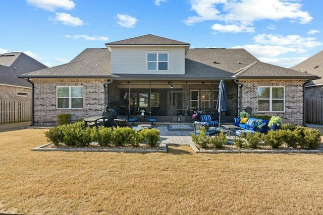 back of house featuring a yard and a patio