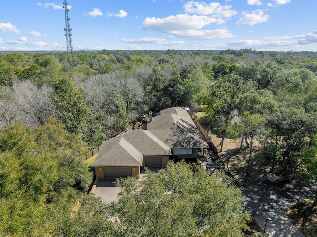 birds eye view of property with a forest view