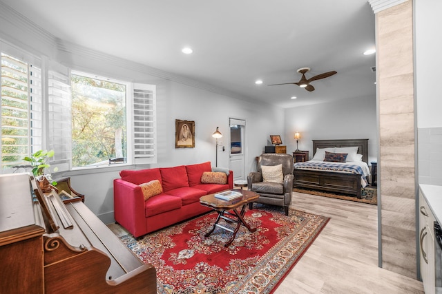 interior space featuring ceiling fan, ornamental molding, light wood-type flooring, and recessed lighting