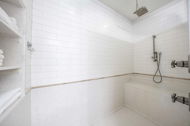 bathroom featuring tiled shower