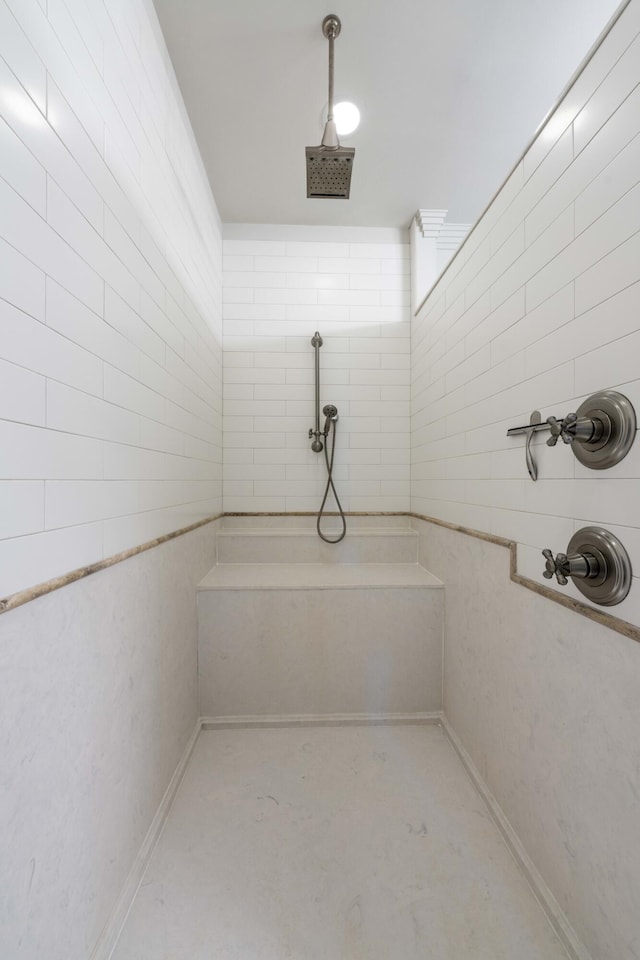 full bath featuring a tile shower