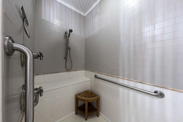 bathroom with tiled shower