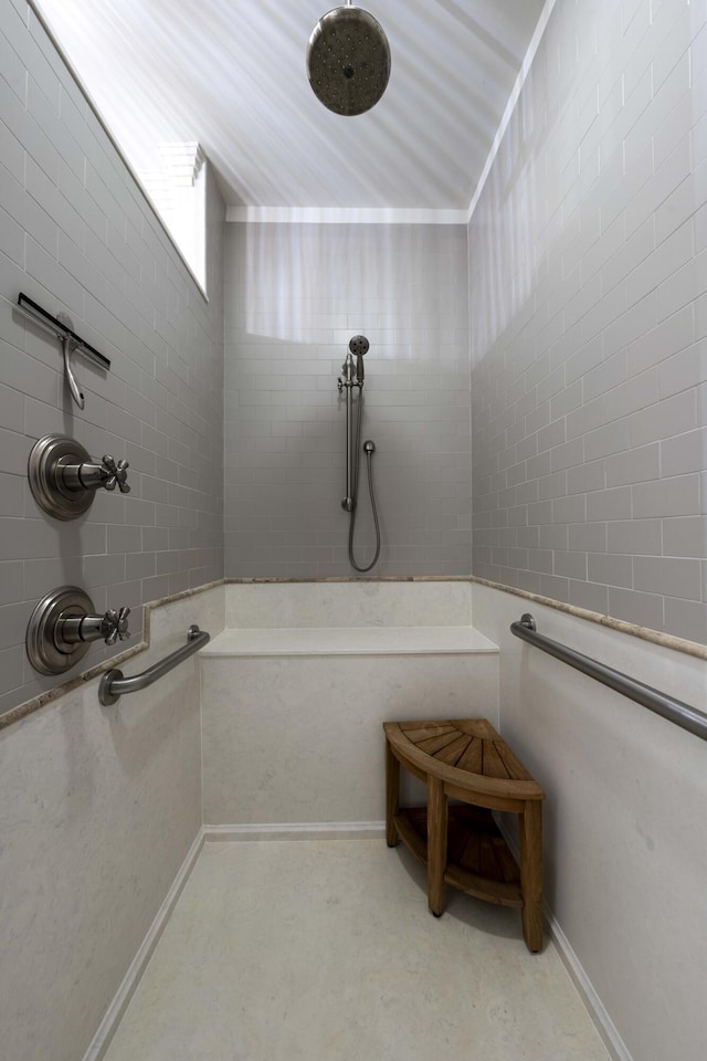 full bath featuring a tile shower