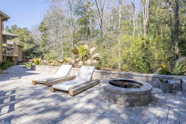 view of patio featuring a fire pit