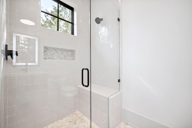 bathroom with an enclosed shower