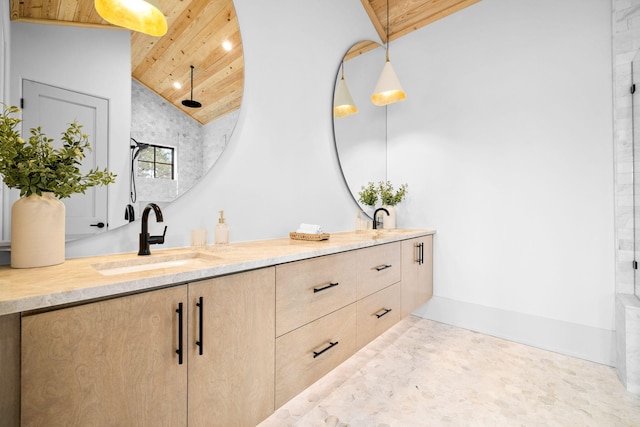 bathroom with vaulted ceiling, vanity, and wood ceiling