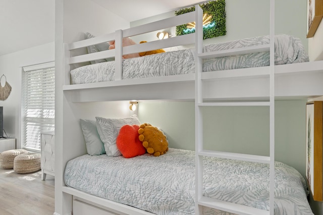 bedroom featuring wood finished floors