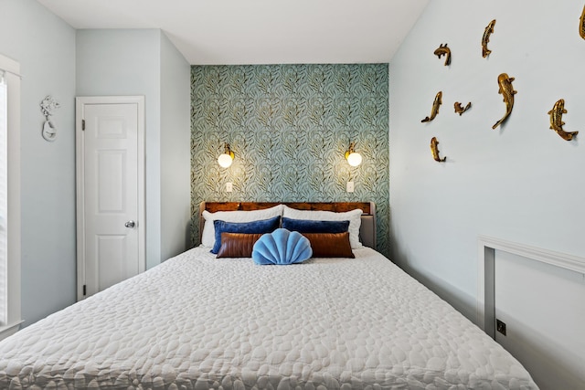 bedroom featuring wallpapered walls