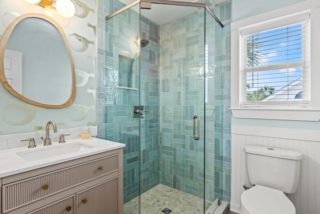 full bath with toilet, a shower stall, and vanity