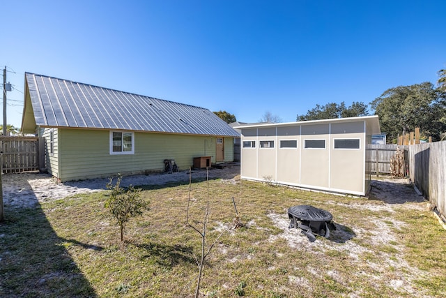 rear view of house with a lawn