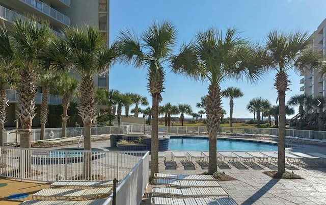 view of swimming pool with a patio