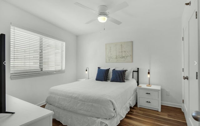 bedroom featuring dark wood-type flooring and ceiling fan