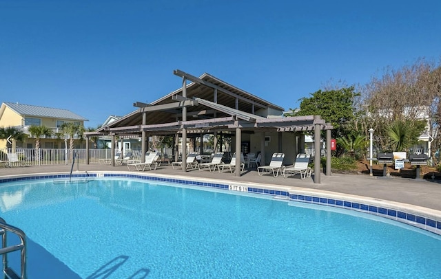 view of pool with a patio area and a pergola